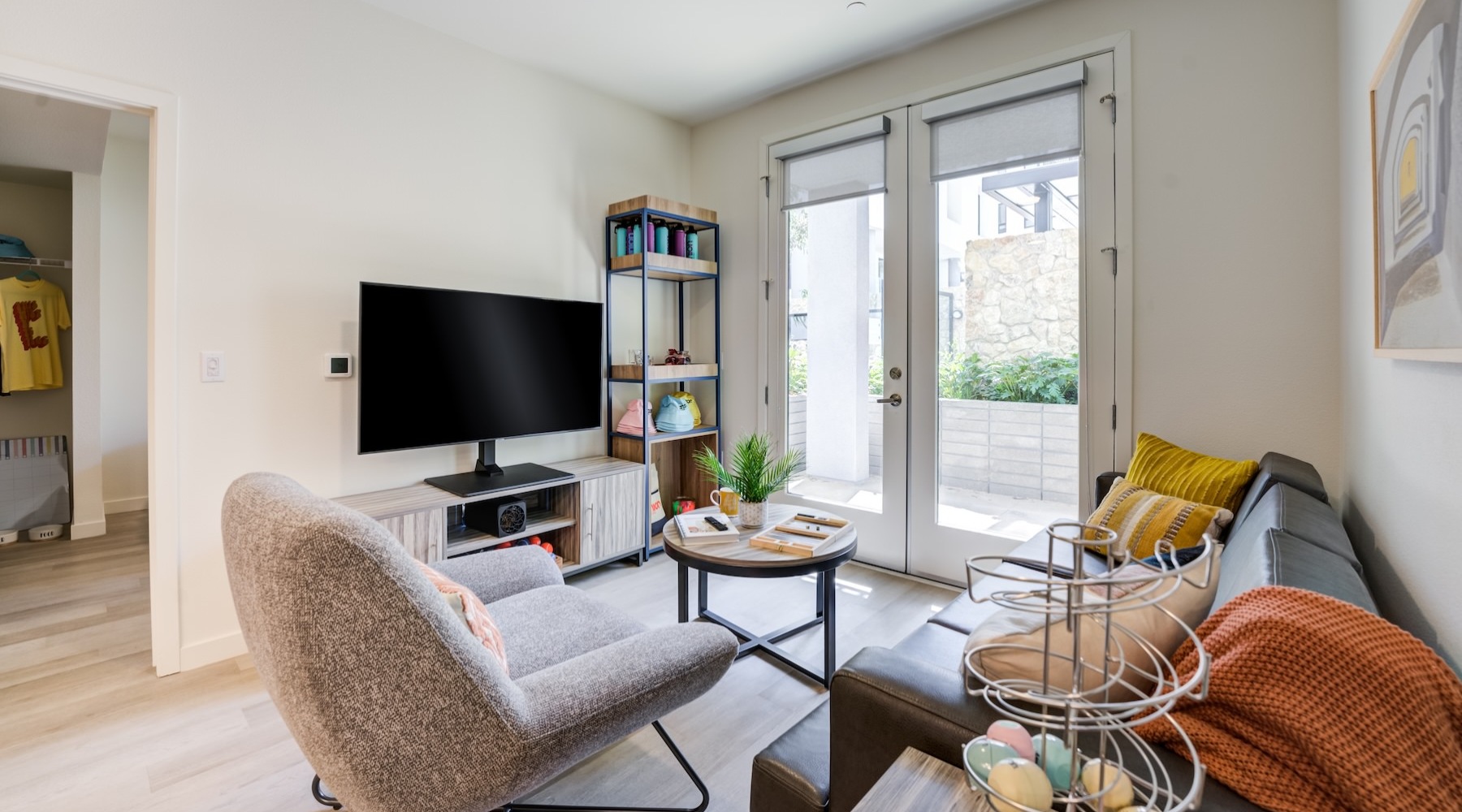 a living room with a couch, chair and a tv