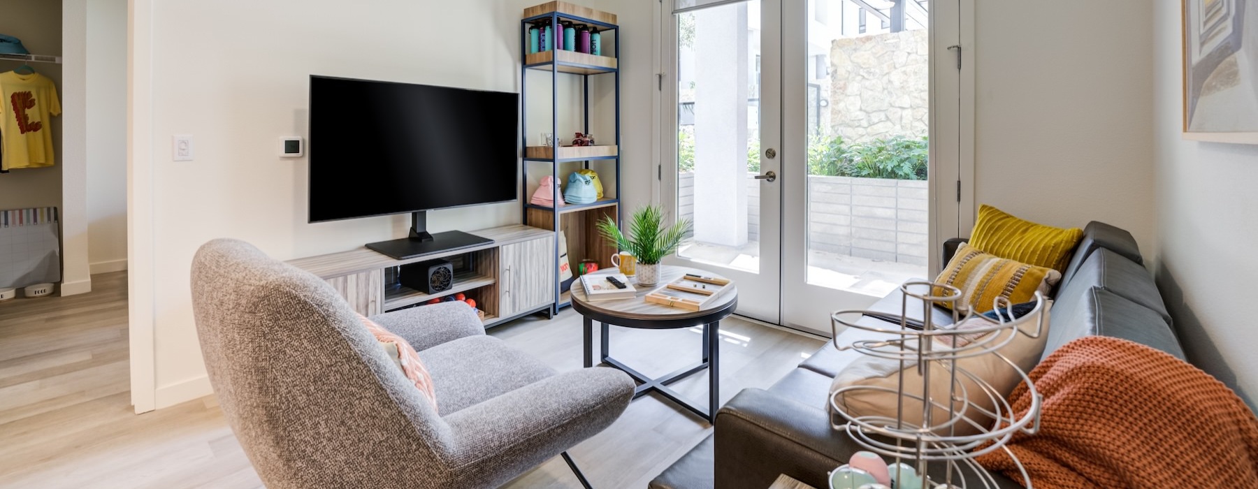 a living room with a couch, chair and a tv
